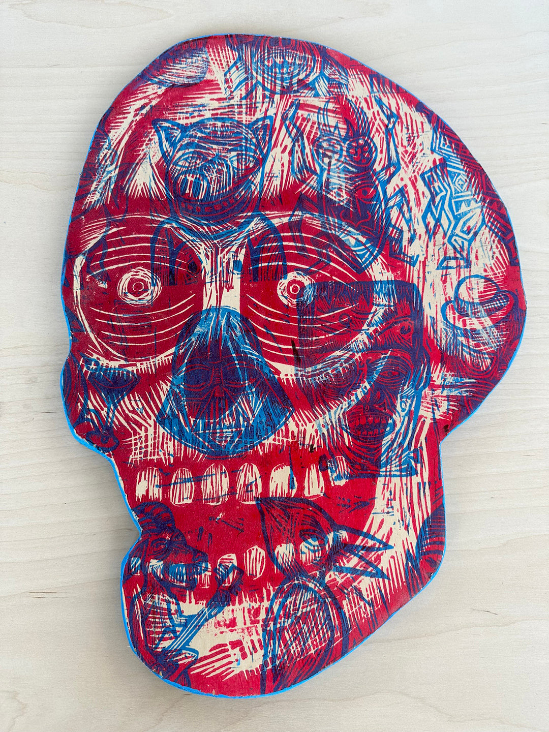 Red and Blue Skull Woodcut Printed on Wooden Panel